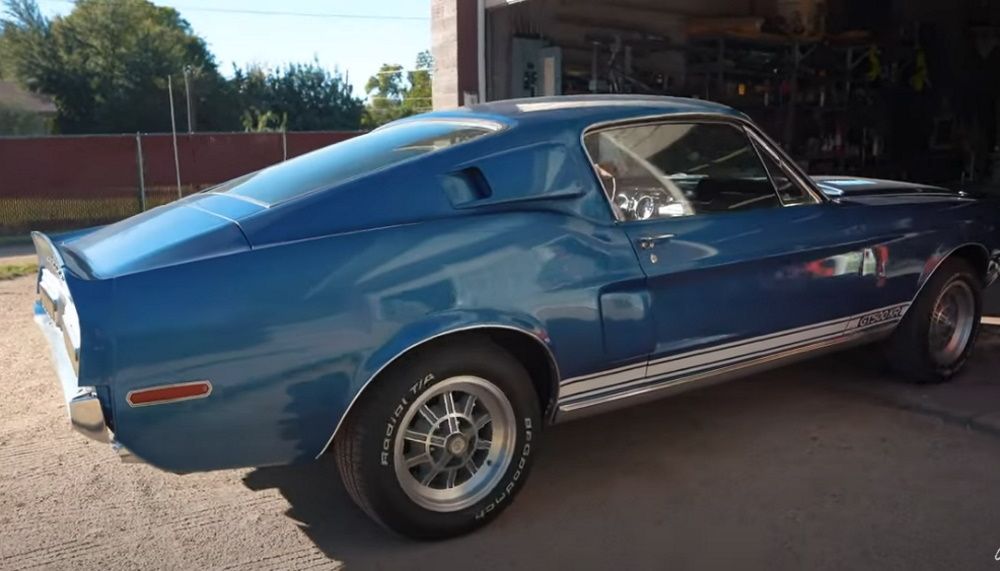 A 1968 Shelby GT500KR leaving the garage, rear