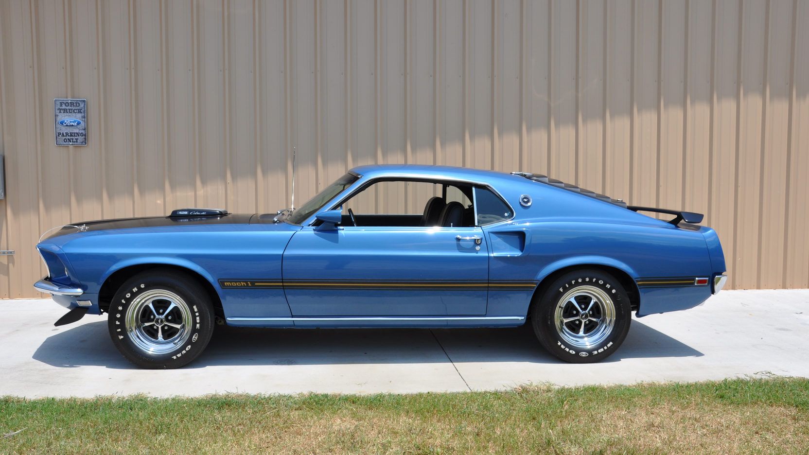 A parked 1969 Ford Mustang Mach I Cobra Jet