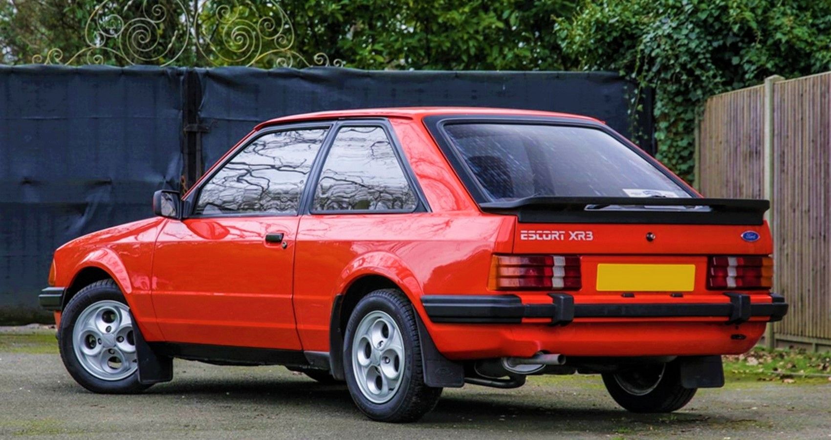 Red Escort XR3 in a compound